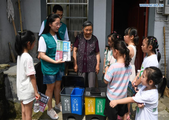 Volunteers Share Knowledge of Garbage Sorting with Locals at